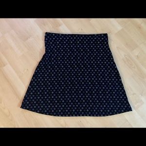 Mini skirt in black and pastel mini flowers